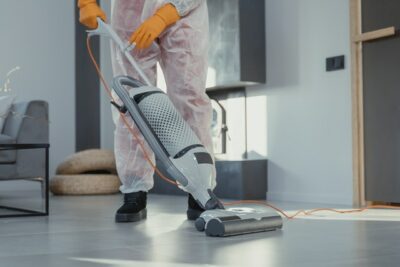 Person vacuuming for Houston building cleaning