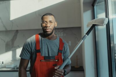 Janitor holding mop for Houston office cleaning services