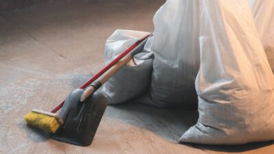 Cleaning tools and trash bags in post construction space after Houston commercial cleaning services