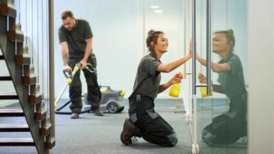 Man and woman from Houston business cleaning near me cleaning local office